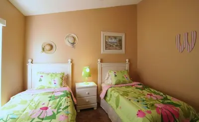 two beds in a small room with two beds sidx sidx sidx at Emma Castle - private fenced home 3 miles to Disney in Kissimmee
