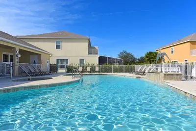 a swimming pool in front of a apartment building at 3 Bedroom Private Pool With Spa Near Disey villa in Orlando