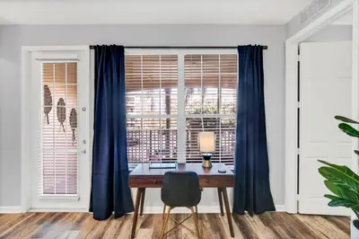 a dining room with a table and a window at Vista Cay Magic condo in Orlando