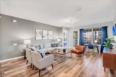 a living room with a couch and a table at Vista Cay Magic condo in Orlando