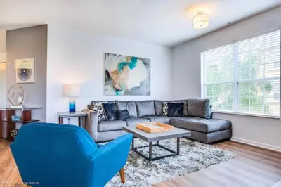 a living room with a couch and a table at Vista Cay Electra condo in Orlando