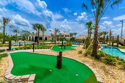a golf course at the resort with a putting green at 8 Bed Storey Lake Resort- Huge Bedroom for Kids home in Kissimmee