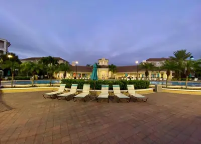 a row of white chairs sitting in a plaza at LakeView Penthouse Elegance condo in Orlando