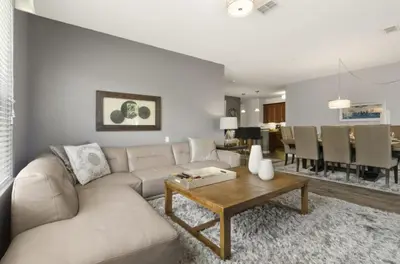 a living room with a couch and a table at Vista Cay Luxury Secret condo in Orlando