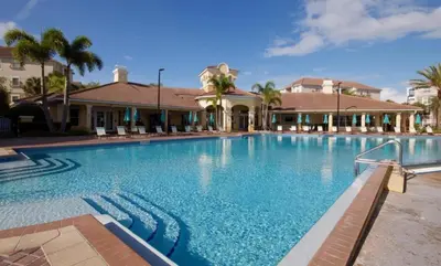 a large swimming pool in front of a house at Vista Cay Luxury Secret condo in Orlando