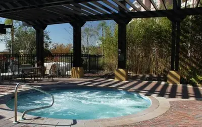 a hot tub in a patio with a gazebo at Lake View 3 Bedroom In Vista Cay Resort condo in Orlando