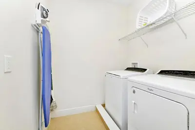 a laundry room with a washer and dryer at Enchanting Home Near Disney With Game And Themed Rooms With Waterpark & Resort Access At Encore Resorts Reunion - 7403Mr in Kissimmee