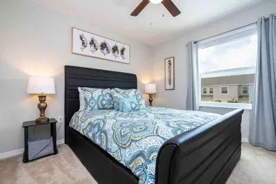 a bedroom with a bed and a window at Stunning 3Bd Close to Disney at Fiesta Key 4764 in Kissimmee