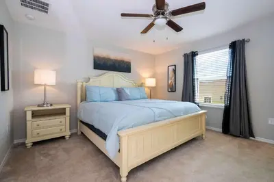 a bedroom with a bed and a ceiling fan at Stunning 3Bd Close to Disney at Fiesta Key 4764 in Kissimmee