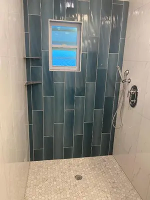 a bathroom with a shower with a window at Clear Lake Retreat: Private pool, lakefront in Orlando