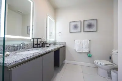 a bathroom with a sink and a toilet at Marvelous 3Bd w Pool Near Disney at Serenity 1536 in Orlando