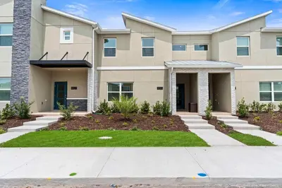 a large apartment building with a driveway at 4423 Scene Lane in Kissimmee