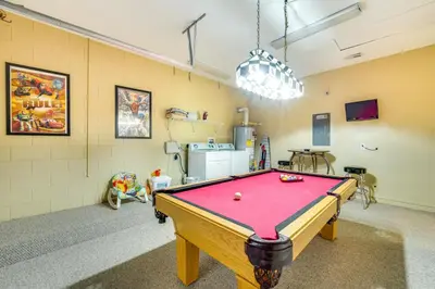 a room with a pool table in it at 10 Mi to Disney Home with Game Room and Lanai! in Kissimmee