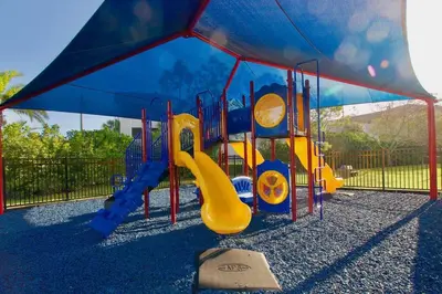 a playground with a slide and a slideintend at Vista Cay Luxury Loft in Orlando