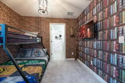a bedroom with a bunk bed and a brick wall at 7992 Cozy 5BD Disney Getaway with Pool in Orlando