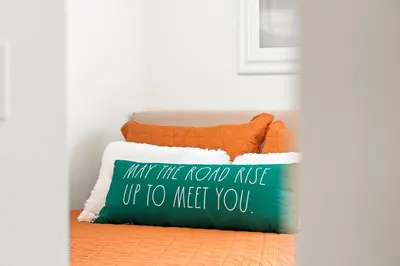 a pillow that says may the road rage up to meet you at Private Oasis in Kissimmee - Pool, BBQ, Free Parking in Orlando