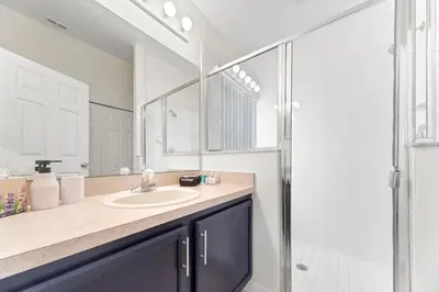a bathroom with a sink and a shower at Private Oasis in Kissimmee - Pool, BBQ, Free Parking in Orlando