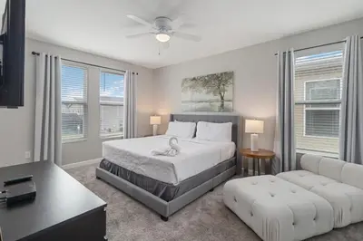 a bedroom with a bed and a couch at Storey Lake Resort, Private Pool, And Much More!! in Kissimmee