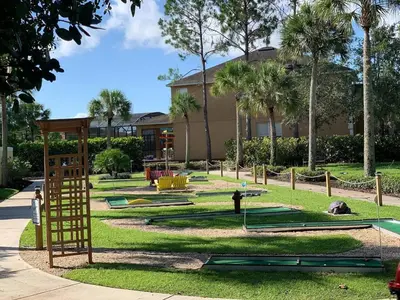 a playground with play equipment in a park at Comfort Home with BBQ, Private Pool & Hot tub in Kissimmee
