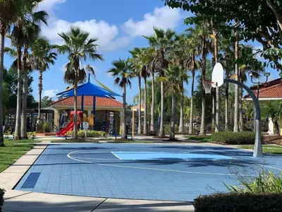 a basketball court in a park with palm trees at Comfort Home with BBQ, Private Pool & Hot tub in Kissimmee