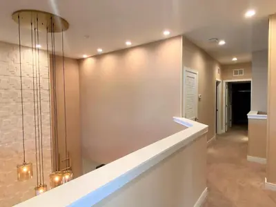 a hallway of a home with a wall at Family Home w BBQ, 7 Min from Disney, Accessible in Orlando