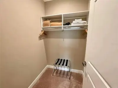 a small closet with a chair in a room at Family Home w BBQ, 7 Min from Disney, Accessible in Orlando