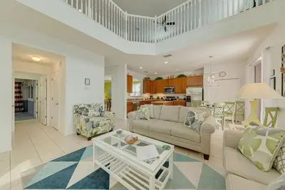 a living room with a couch and a table at 558 - Veranda Palms House in Kissimmee