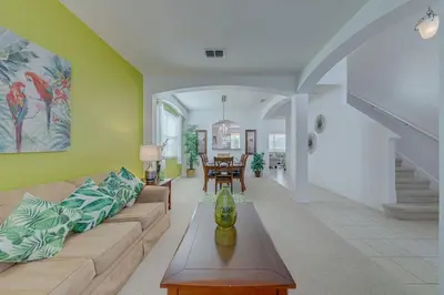 a living room with a couch and a table at 558 - Veranda Palms House in Kissimmee