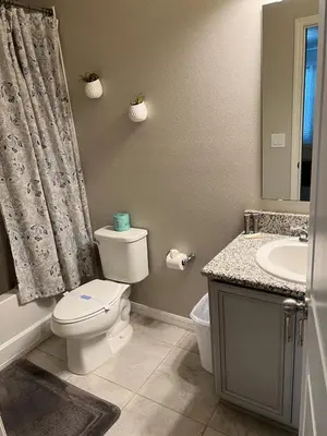 a bathroom with a toilet and a sink at Vacation Home for 8, near Disney and Universal in Kissimmee
