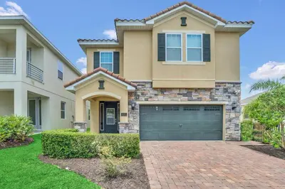 a house with a brick driveway in front of it at 450 Paradise 8BD Villa- Game Room PoolSpa in Orlando