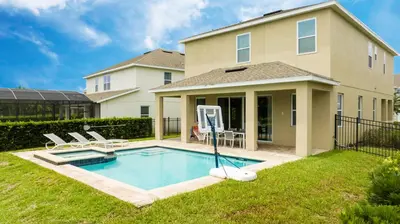 a house with a swimming pool in the yard at Unforgettable Experience Luxury Vacation Home 7479 in Orlando