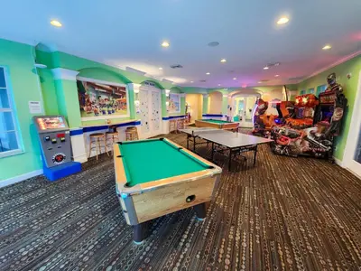a childrens play room with a pool table and games at Family Friendly Disney Villa (4 Miles from Disney) in Kissimmee