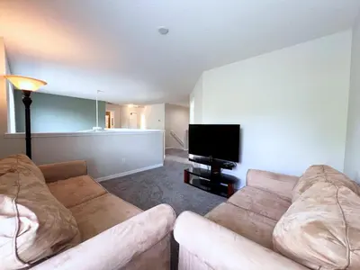a living room with two couches and a flat screen tv at Beautiful 6Bd Pool Hm Veranda Palms-4464NP in Kissimmee
