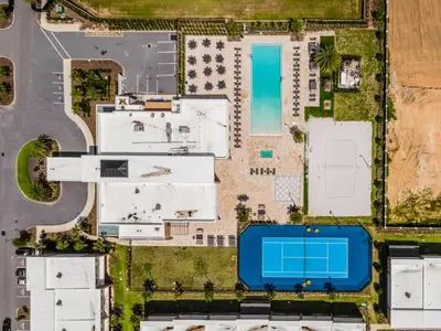 an overhead view of a building with a swimming pool at 7594 Magic Village 3suites 6guets 8 min Disney in Orlando
