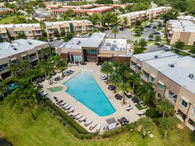 an aerial view of a resort with a swimming pool at 3212 Magic Village 8 guests lakefront 8 min Disney in Orlando