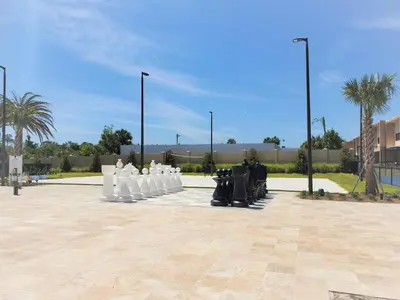 a group of white sculptures in a parking lot at 3053 Magic Village 3 suites jacuzzi BBQ 6min Disney in Orlando