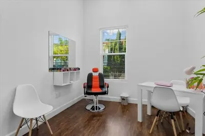 a white office with a desk and two chairs at 3212 WL 8 guests corner 192 near from Disney in Kissimmee