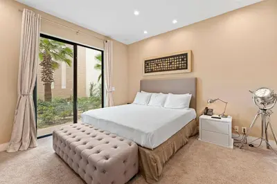 a bedroom with a bed and a large window at 7478 Magic Village 8guests 4suites 8min Disney in Orlando