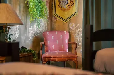 a pink chair sitting in a corner of a room at Stay at Hogwarts Harry Potter's Home, Free Parking, Pets Allowed in Kissimmee