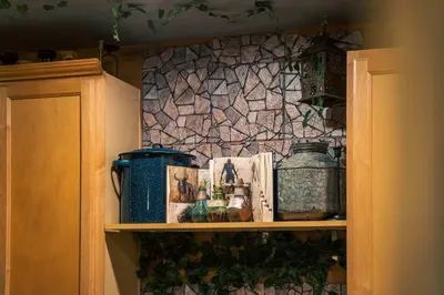 a shelf in a kitchen with books and jars at Stay at Hogwarts Harry Potter's Home, Free Parking, Pets Allowed in Kissimmee