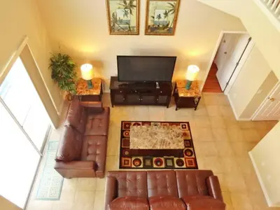 an overhead view of a living room with leather furniture at Edwin Island - Luxury home, Excellent location, Gated-Community in Kissimmee