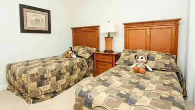 a bedroom with two beds with stuffed animals on them at 2505 Archfeld in Kissimmee