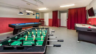 a room with a pool table and ping pong balls at 2566 Archfeld in Kissimmee