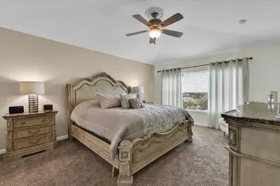 a bedroom with a bed and a ceiling fan at 2574 Archfeld in Kissimmee