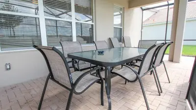 a black table and chairs on a patio at 2582 Archfeld in Kissimmee