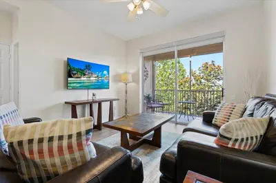 a living room with a couch and a table at 2774 Almaton #403 in Kissimmee