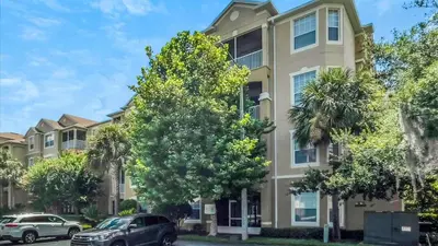 a building with cars parked in front of it at 2788 Almaton #301 in Kissimmee