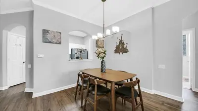 a dining room with a table and chairs at 2788 Almaton #301 in Kissimmee
