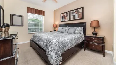 a bedroom with a bed and two night stands at 2809 Almaton #101 in Kissimmee