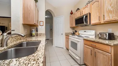 a kitchen with a sink and a stove at 2809 Almaton #101 in Kissimmee